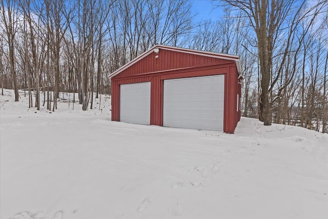 view of snow covered garage