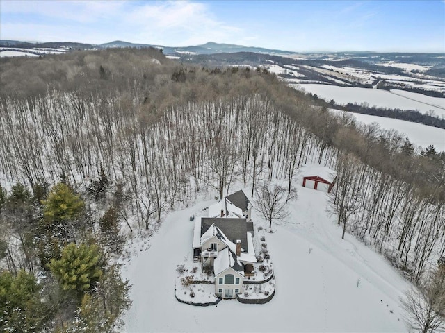 snowy aerial view featuring a mountain view