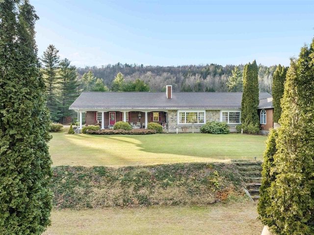 ranch-style home with a front lawn