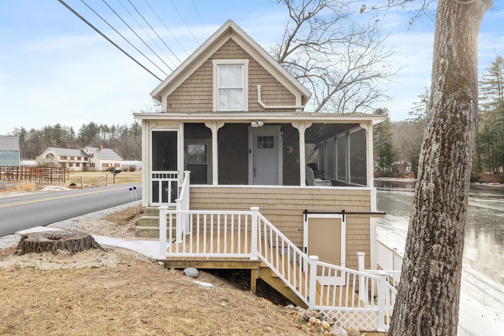 view of front of property with a sunroom