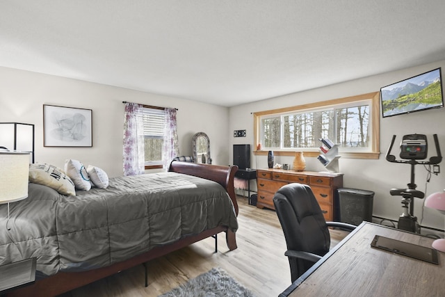 bedroom with light hardwood / wood-style flooring