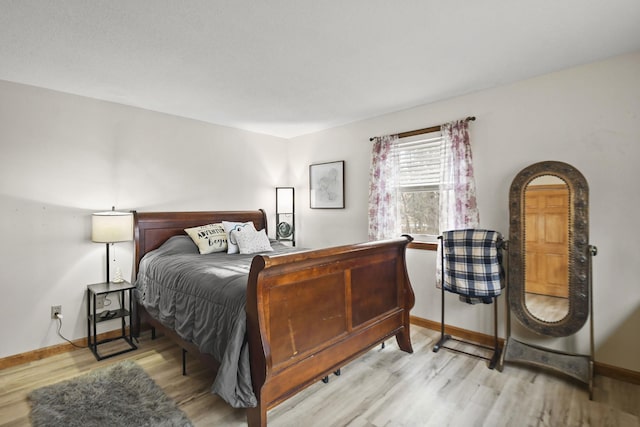 bedroom with light hardwood / wood-style floors