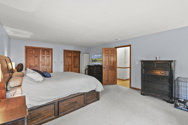 bedroom featuring light carpet