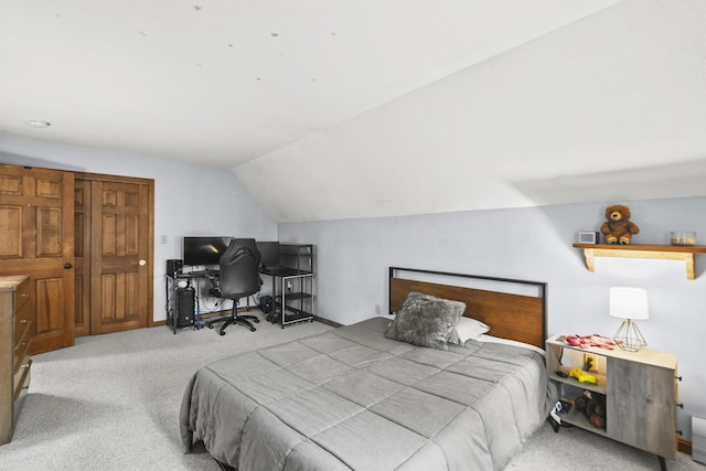 bedroom with light carpet and vaulted ceiling