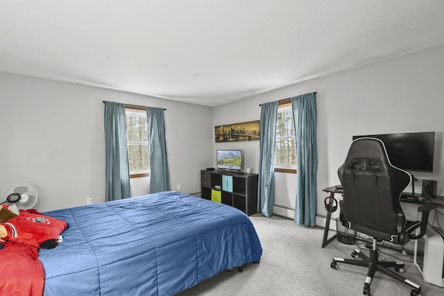 bedroom featuring light carpet and a baseboard radiator