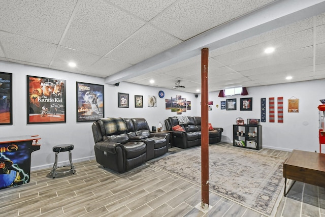 home theater room featuring a paneled ceiling