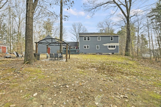 back of house featuring a gazebo