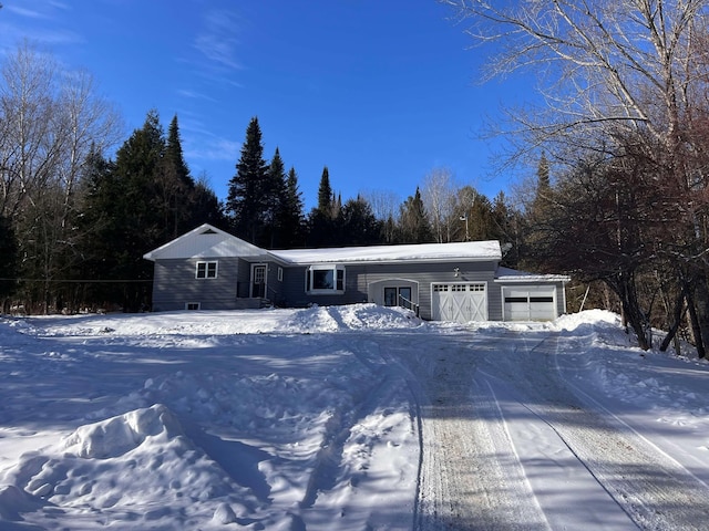 single story home with a garage