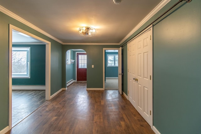 entryway featuring dark wood-type flooring, plenty of natural light, and a baseboard heating unit