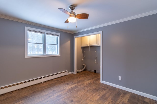 spare room featuring dark hardwood / wood-style flooring, crown molding, ceiling fan, and a baseboard heating unit