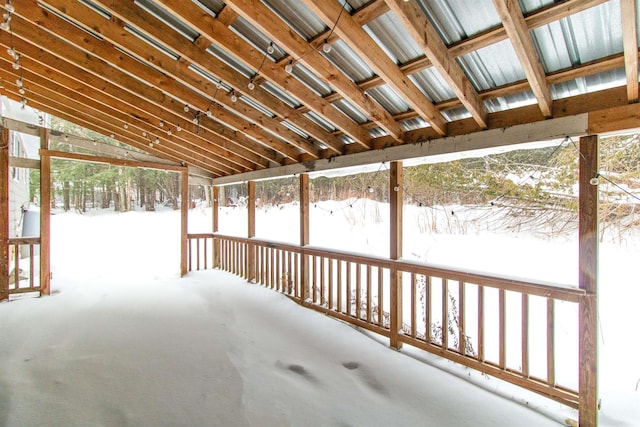 unfurnished sunroom with vaulted ceiling