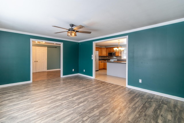 unfurnished living room with crown molding, light hardwood / wood-style flooring, and ceiling fan with notable chandelier