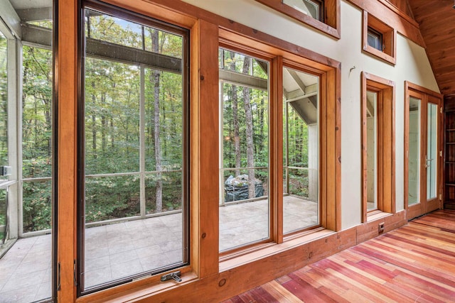 entryway with light hardwood / wood-style flooring and lofted ceiling