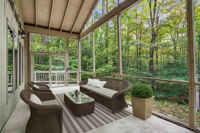 sunroom / solarium with wooden ceiling and vaulted ceiling