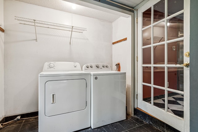 washroom featuring washer and clothes dryer