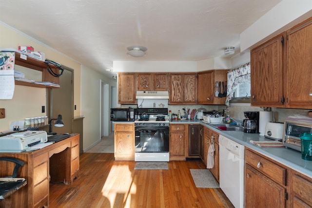 kitchen with backsplash, sink, white appliances, and light wood-type flooring