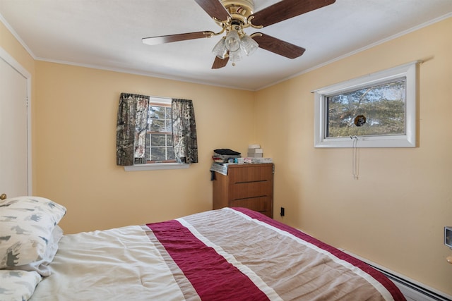 bedroom with a baseboard radiator, ceiling fan, and crown molding