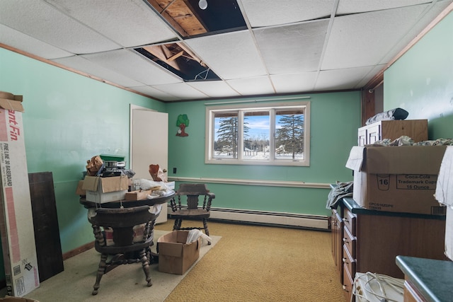 misc room featuring light carpet, baseboard heating, and a drop ceiling