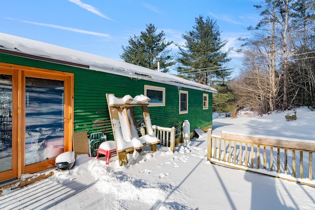 view of snow covered house