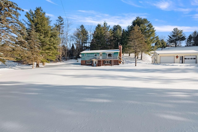 view of front facade with an outbuilding and a garage