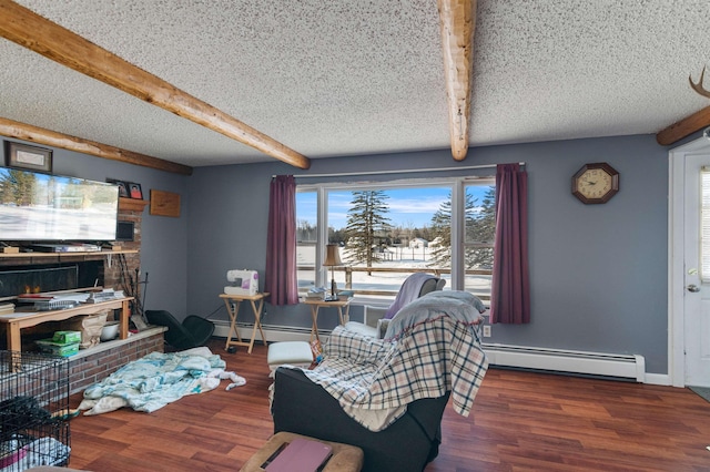 living room with baseboard heating, a fireplace, and a textured ceiling