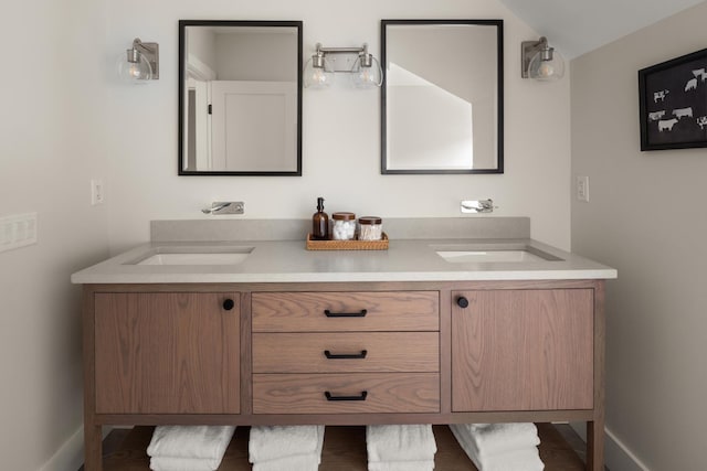 bathroom featuring vanity and vaulted ceiling