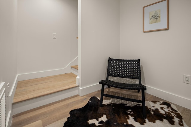 sitting room featuring light hardwood / wood-style floors