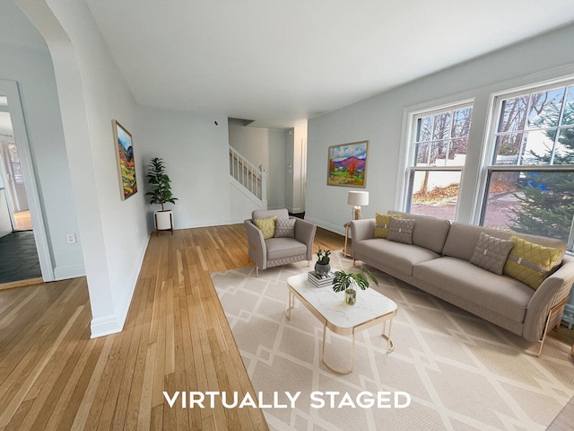 living room with light hardwood / wood-style flooring