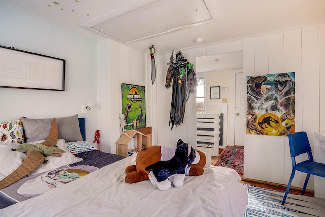 bedroom with hardwood / wood-style flooring