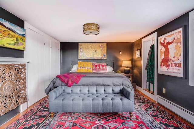 bedroom with a baseboard heating unit