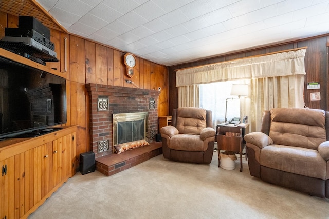 carpeted living room featuring wooden walls and a brick fireplace