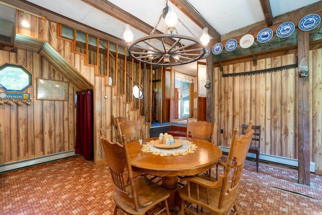 dining space featuring beam ceiling, wooden walls, and a notable chandelier