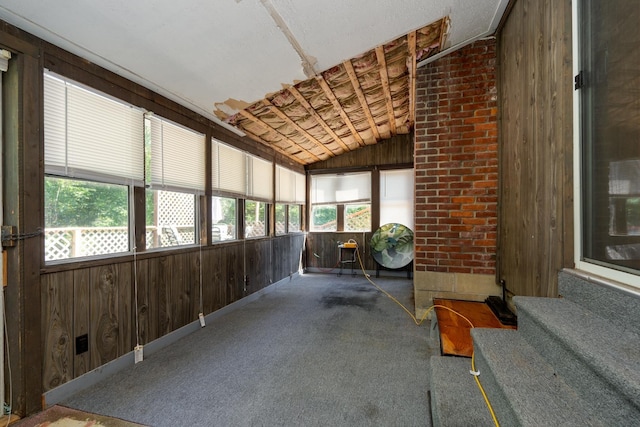 sunroom / solarium with vaulted ceiling