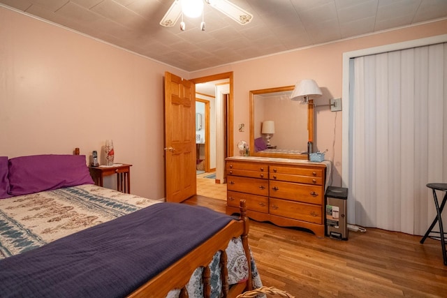 bedroom featuring hardwood / wood-style floors and ceiling fan