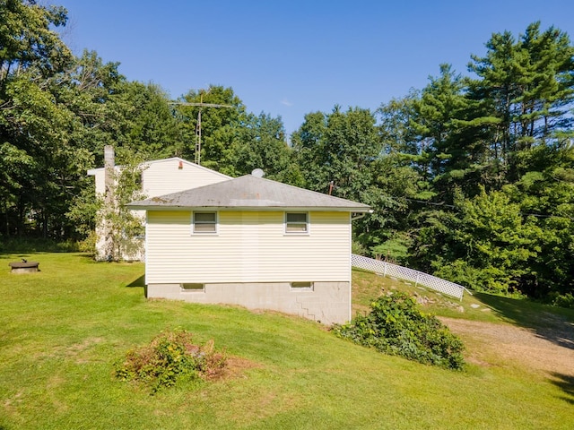 view of home's exterior featuring a lawn