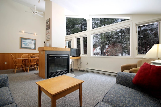 living room featuring carpet flooring, a baseboard radiator, ceiling fan, and lofted ceiling