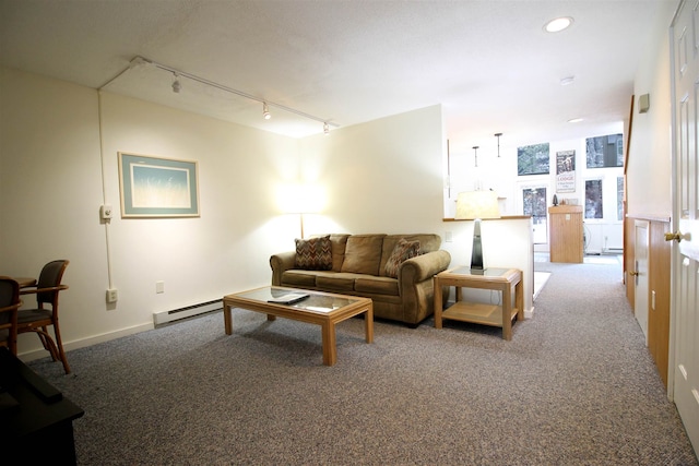 carpeted living room with baseboard heating and track lighting