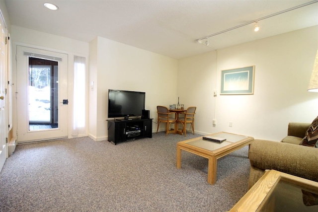 living room with carpet floors and track lighting