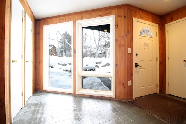 doorway with wood walls