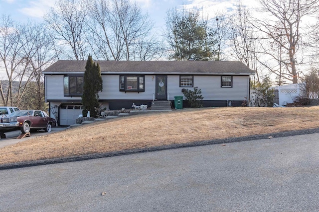 view of front of property with a garage