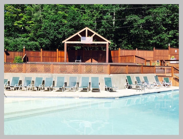 view of swimming pool featuring a gazebo