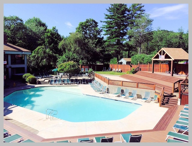 view of swimming pool featuring a gazebo and a patio