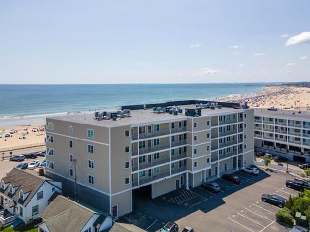 bird's eye view featuring a view of the beach and a water view