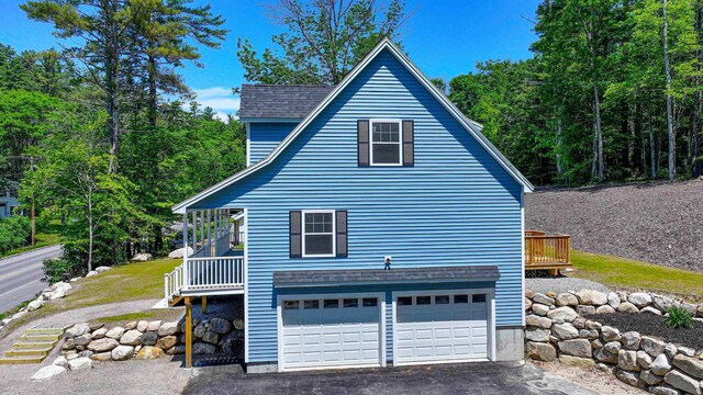 363 Main St, Fryeburg, ME 04037 - view of side of property with a garage and driveway
