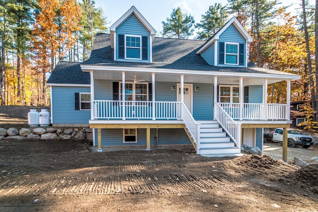 363 Main St, Fryeburg, ME 04037 - view of front of house featuring a porch, roof with shingles, and dirt driveway