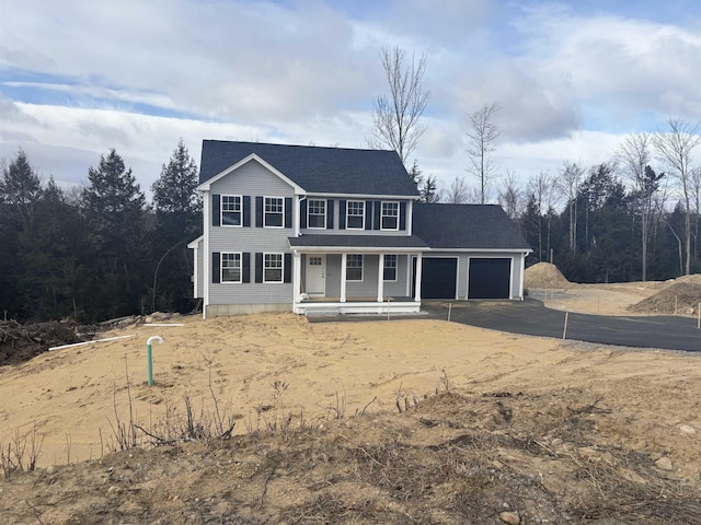 view of front of property with a garage and a porch