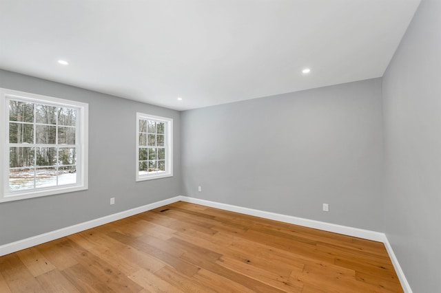 empty room with light hardwood / wood-style floors