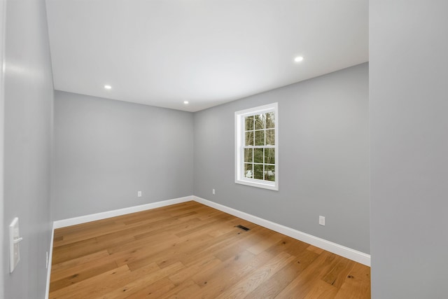 spare room featuring light hardwood / wood-style flooring