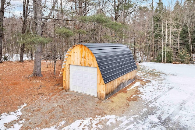 view of snow covered garage