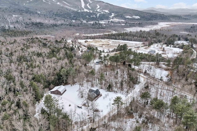 snowy aerial view with a mountain view